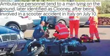  ??  ?? Ambulance personnel tend to a man lying on the involved in a scooter accident in Italy on July 10.