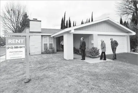  ?? Mel Melcon Los Angeles Times ?? A SINGLE-FAMILY RENTAL house owned by Invitation Homes is seen in Canoga Park in 2013. The company’s merger with Starwood Waypoint Homes is the highest-profile and largest yet in the industry, creating a company that will own 82,000 homes nationwide.