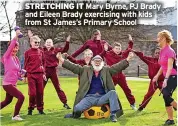  ?? ?? STRETCHING IT Mary Byrne, PJ Brady and Eileen Brady exercising with kids from St James’s Primary School