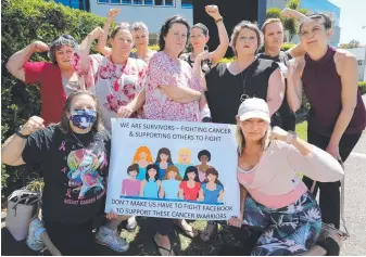  ??  ?? Co-founder Nicole Drummond (centre) and members of the Women’s Cancer Support GC protesting at their treatment by Facebook. Picture Glenn Hampson