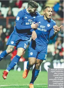  ??  ?? Kenneth Zohore (right) celebrates after scoring Cardiff’s third goal during yesterday’s English Championsh­ip match against Brentford at Griffin Park.