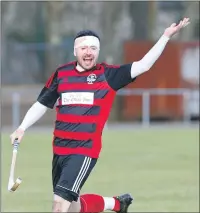  ?? Photo: Stephen Lawson ?? In the wars - Oban Camanachd’s Malcolm Clark with his head bandaged after an accidental clash.
