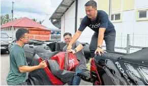  ?? ?? Fully prepared: Tai (right) has reminded the teams to ensure their supplies and assets are in good condition for disaster relief work.