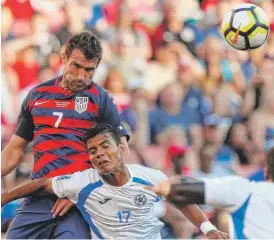  ?? | JAY LAPRETE/ GETTY IMAGES ?? U. S. midfielder Chris Pontius heads the ball away from Nicaragua’s Bismarck Veliz during the CONCACAF Gold Cup on Saturday in Cleveland.