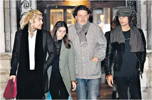  ??  ?? Marco Pierre White leaves the Royal Courts of Justice in London with his children Marco White Jr, left, and Luciano White, right