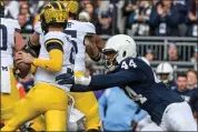  ?? ASSOCIATED PRESS FILE PHOTO ?? Penn State defensive end Chop Robinson (44) pressures Michigan quarterbac­k J.J. McCarthy (9), Nov.11, 2023, in State College, Pa.