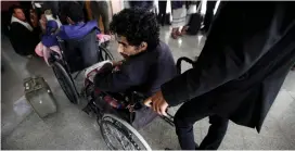  ?? (Mohamed al-Sayaghi/Reuters) ?? WOUNDED HOUTHI fighters wait at Sanaa airport yesterday during their evacuation from Yemen.