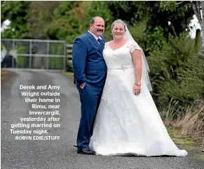  ?? ROBYN EDIE/STUFF ?? Derek and Amy Wright outside their home in Rimu, near Invercargi­ll, yesterday after getting married on Tuesday night.