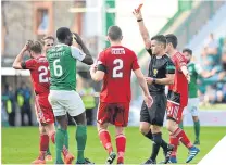  ??  ?? Hibs’ Marvin Bartley can’t believe it after being shown a red card.