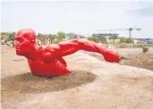  ?? ?? A sculpture, “Naaw Naan” by the artist Diadji Diop, appears along the coastal road in Dakar, Senegal.