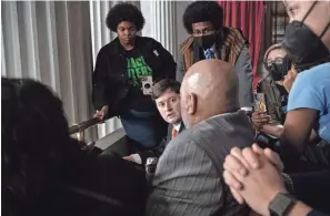  ?? PHOTOS BY NICOLE HESTER/THE TENNESSEAN ?? Rodney Wells and Rowvaughn Wells, parents of Tyree Nichols, speak with Rep. John Gillespie, R-memphis, while Rep. Justin Pearson, D-memphis, stands by during a Tennessee House session at the State Capitol in Nashville on March 4.