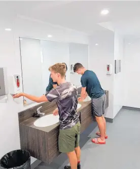  ?? Photos / Supplied ?? Camp Raukawa staff Zeke Cochrane (left) and Niall Ringrose (right) make use of the newly renovated bath house.