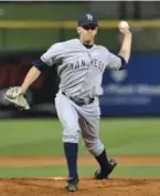  ??  ?? New York Yankees prospect Pat Venditte throws right-handed, above, for the Class-a Tampa Yankees during a game against the Clearwater Threshers in 2010. Vendetti, who also pitched left-handed, left, in the game, is the only switch pitcher in...