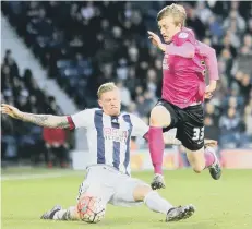  ??  ?? Posh midfielder Chris Forrester skips past James McClean