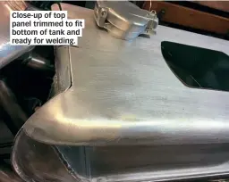  ??  ?? Close- up of top panel trim ed to fit bottom of tank and ready or welding .