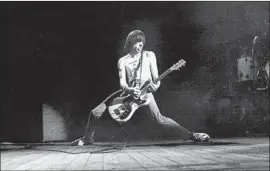  ?? David Corio Getty Images ?? JOHNNY RAMONE, circa 1980, performing with punk quartet the Ramones.