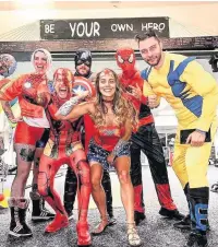  ??  ?? ●●Hero Fitness staff dressed as superheroe­s