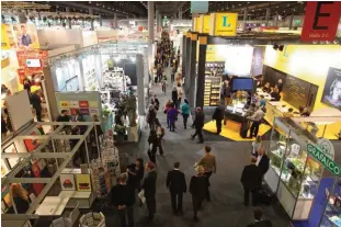  ?? —AFP ?? FRANKFURT: This file photo taken on October 09, 2013 shows fairgoers visiting the Frankfurt Book Fair.