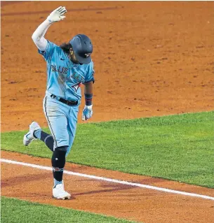  ?? JEFFREY T. BARNES THE ASSOCIATED PRESS ?? Bo Bichette celebrates his three-run homer during the sixth inning of Tuesday’s 5-4 win against the Miami Marlins in Buffalo, N.Y.