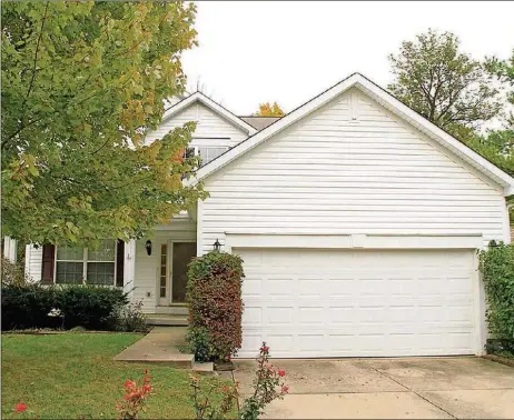  ?? CONTRIBUTE­D PHOTOS BY KATHY TYLER ?? The two-story home, with about 2,050 square feet of living space, is located within the Village of Pheasant Ridge. The backyard has access to woods, with no rear neighbors.