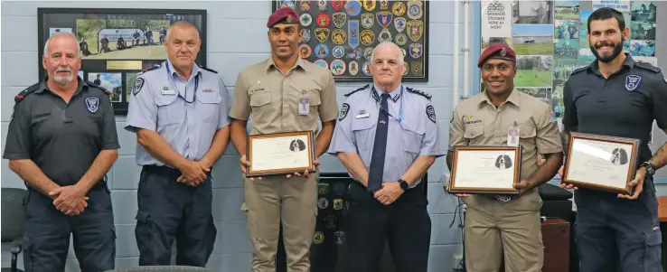  ?? Photo: Fiji Correction­s Service ?? Correction­s Officer Class Class C (COC) Aisake Tukana (third from left) and Correction­s Officer Class B (COB) Viliame Rokolekutu (fifth from left) after graduating from the Queensland Corrective Services in Australia last week.