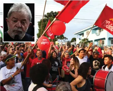  ??  ?? Supporters of Lula (inset) demonstrat­e outside the Federal Police where he is detained in Curitiba, Parana State, Brazil. — AFP photo