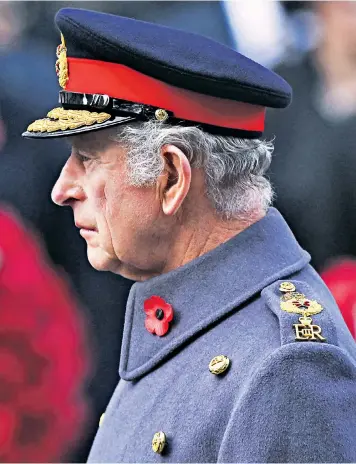  ?? ?? The King laid a wreath signed Charles R at the Cenotaph in Whitehall yesterday in silent tribute to Britain’s lost service men and women