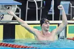  ??  ?? ADELAIDE: Elijah Winnington celebrates after winning the men’s 400m freestyle final during day one of the Australian Olympic swimming trials yesterday. —AFP