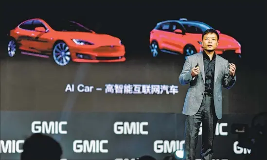  ?? VCG via Getty Images ?? HE XIAOPENG speaks at a tech conference in Beijing in April. The chairman of Xpeng Motors envisions self-driving cars becoming data-collecting hardware devices.