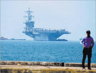  ?? Tran Van Minh ?? The Associated Press The USS Carl Vinson anchored Monday at Tien Sa Port in Danang, Vietnam. The U.S. aircraft carrier is visiting a Vietnamese port for the first time since the Vietnam War.