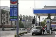  ?? MARCIO JOSE SANCHEZ — THE ASSOCIATED PRESS ?? Gas prices are advertised at over eight dollars a gallon at a gas station on Oct. 6in Los Angeles.