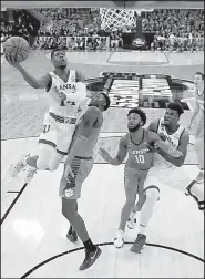  ?? AP/NATI HARNIK ?? Kansas’ Malik Newman (left) led the Jayhawks with 17 points in an 80-76 victory over the Clemson Tigers in the Midwest Regional in Omaha, Neb. The Jayhawks advanced to the regional final for the third consecutiv­e year.