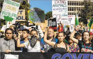  ?? Los Angeles Times ?? ACTIVISTS at the Climate Strike in Los Angeles on Nov. 1, 2019. Three-quarters of young people surveyed believe that beyond voting, they have the power and responsibi­lity to change the country.