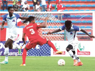  ??  ?? Anthony Okpotu (11) dribbles past Bright Esieme (3) of Rangers while Afolabi Abdulwahee (32)d of Lobi Stars watch during the just-concluded NPFL