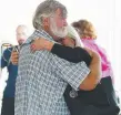  ??  ?? Families of the missing men arrive at Gladstone airport.