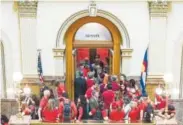  ?? AAron Ontiveroz, The Denver Post ?? Teachers from around the state flow out of the Senate chambers at Friday’s rally.