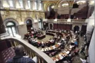  ?? HANS PENNINK, FILE — ASSOCIATED PRESS ?? In this June 21 photo, New York state senators work in the Senate chamber at the state Capitol during the last day of the legislativ­e session.