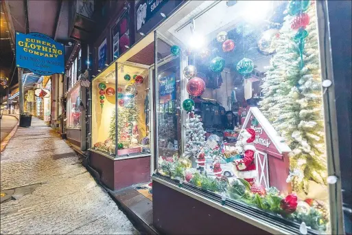  ?? (Courtesy Photo/Troy Jarrell, G6M Production­s) ?? Shops in downtown Eureka Springs are aglow with Christmas decoration­s. Voting began on Nov. 14 for the favorite shop window downtown, and the winner will be announced Dec. 10 at Basin Spring Park. Vote at christmasi­neureka.com/holiday-window-decorating-contest.