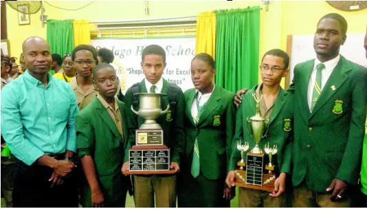  ?? CONTRIBUTE­D ?? Winning St Jago High, School’s Challenge Quiz team with coach Mark Clarke (left) during celebratio­ns at the school on Wednesday.