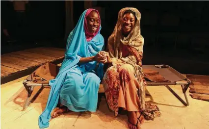  ?? Troy Scheid / Landing Theatre ?? Yemi Otulana as Hawa, left, and Precious Merenu as Hamida in Landing Theatre’s “In Darfur.”