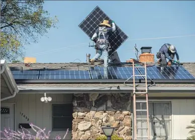  ?? Mel Melcon Los Angeles Times ?? SOLAR PANELS are installed on a roof in Granada Hills in 2020.