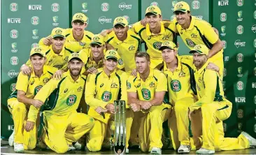  ?? — Agencies ?? The victorious Australian team pose with the trophy after beating Pakistan 4-1 in the five-match ODI series.