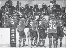  ?? LIAM RICHARDS THE CANADIAN PRESS ?? New national women’s team head coach Perry Pearn speaks to his players. His NHL experience is appreciate­d and his direct advice.