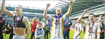  ??  ?? ON THE UP: New Chelmsford City boss Robbie Simpson, centre, helped MK Dons to promotion