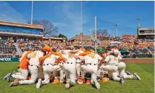  ?? TENNESSEE ATHLETICS PHOTO ?? Tennessee baseball players gather before a game last month against Ole Miss at Lindsey Nelson Stadium. The No. 4 Volunteers are 24-5 this season entering their weekend series at Auburn.