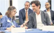  ?? ALIE SKOWRONSKI askowronsk­i@miamiheral­d.com ?? Virgina Gardens Council Member Elizabeth Taylor-Martinez and Bal Harbour Mayor Gabe Groisman share a a moment during Wednesday’s press conference.