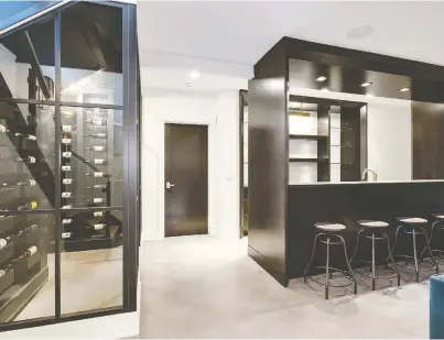  ?? VERANDA ESTATE HOMES ?? Inside a wine room where space for storage, display and tasting are of the utmost importance.