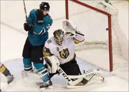  ?? The Associated Press ?? Sharks forward Logan Couture screens Vegas Golden Knights goaltender Marc-Andre Fleury that allowed Evander Kane to score late in Game 3 of their NHL playoff game in San Jose on Monday. Vegas won 4-3 in overtime for a 2-1 series lead.