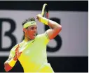  ?? Picture: GETTY IMAGES / CLIVE MASON ?? PERIL IN YELLOW: Rafael Nadal plays a forehand against Yannick Maden during day four of the French Open at Roland Garros on Wednesday.