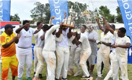  ?? (Photo: Karl Mclarty) ?? Manchester High players and staff celebrate winning the rural area Grace Headley Cup after beating May Day High in the final at Manchester High on Friday.